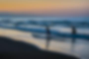 A mother playing with her son in the beach